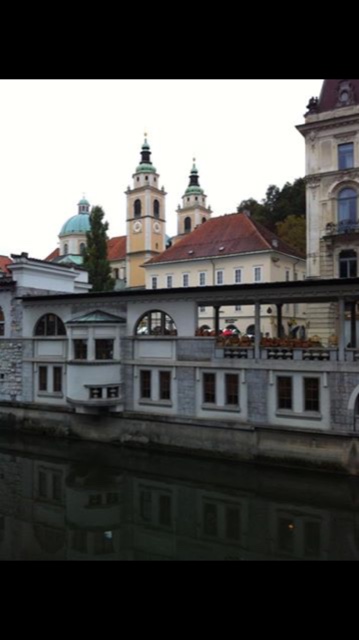 Ljubljana riverside with historic buildings and churches