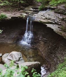 Small waterfall cascading into a rocky pool