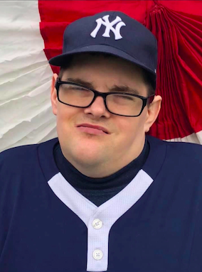 Man in Yankees uniform and hat